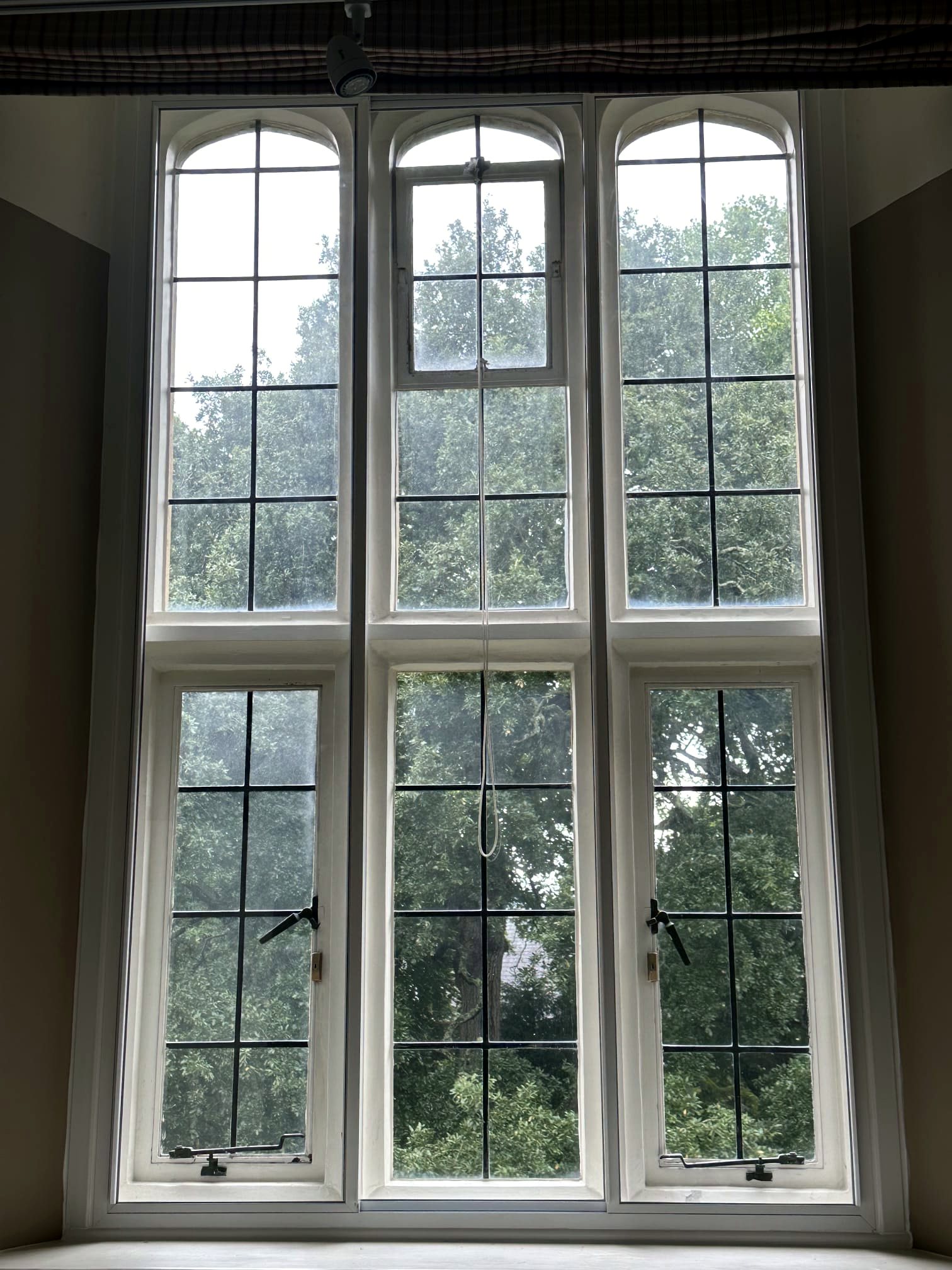 Bright arched leaded secondary glazing