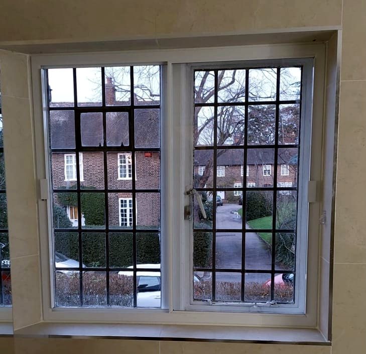 Slimline secondary glazing in a bay casement