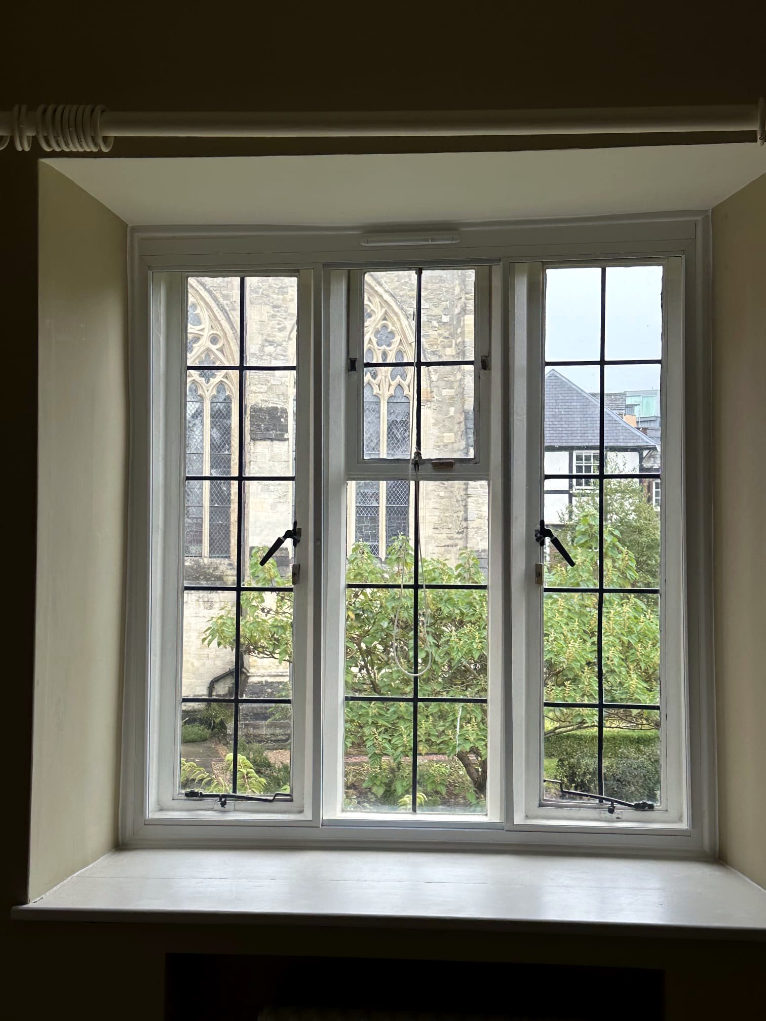 Leaded secondary glazing in a deep-reveal bay
