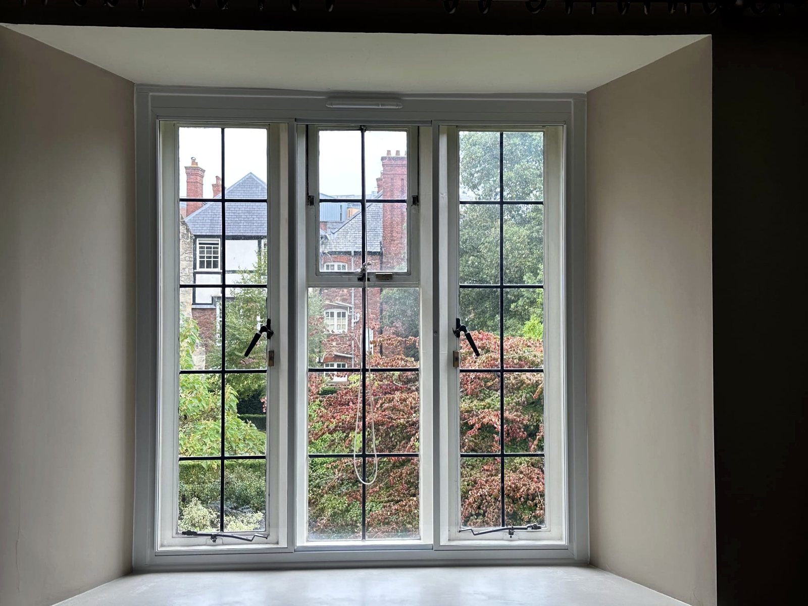 Leaded secondary glazing bay with a garden view