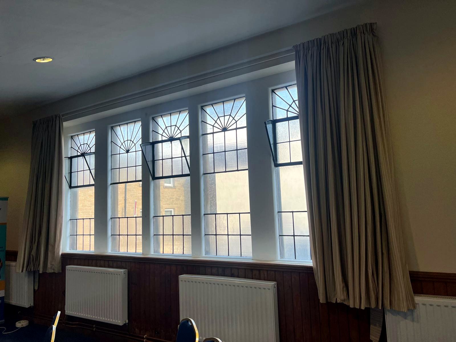 A long run of leaded secondary glazing in a lounge