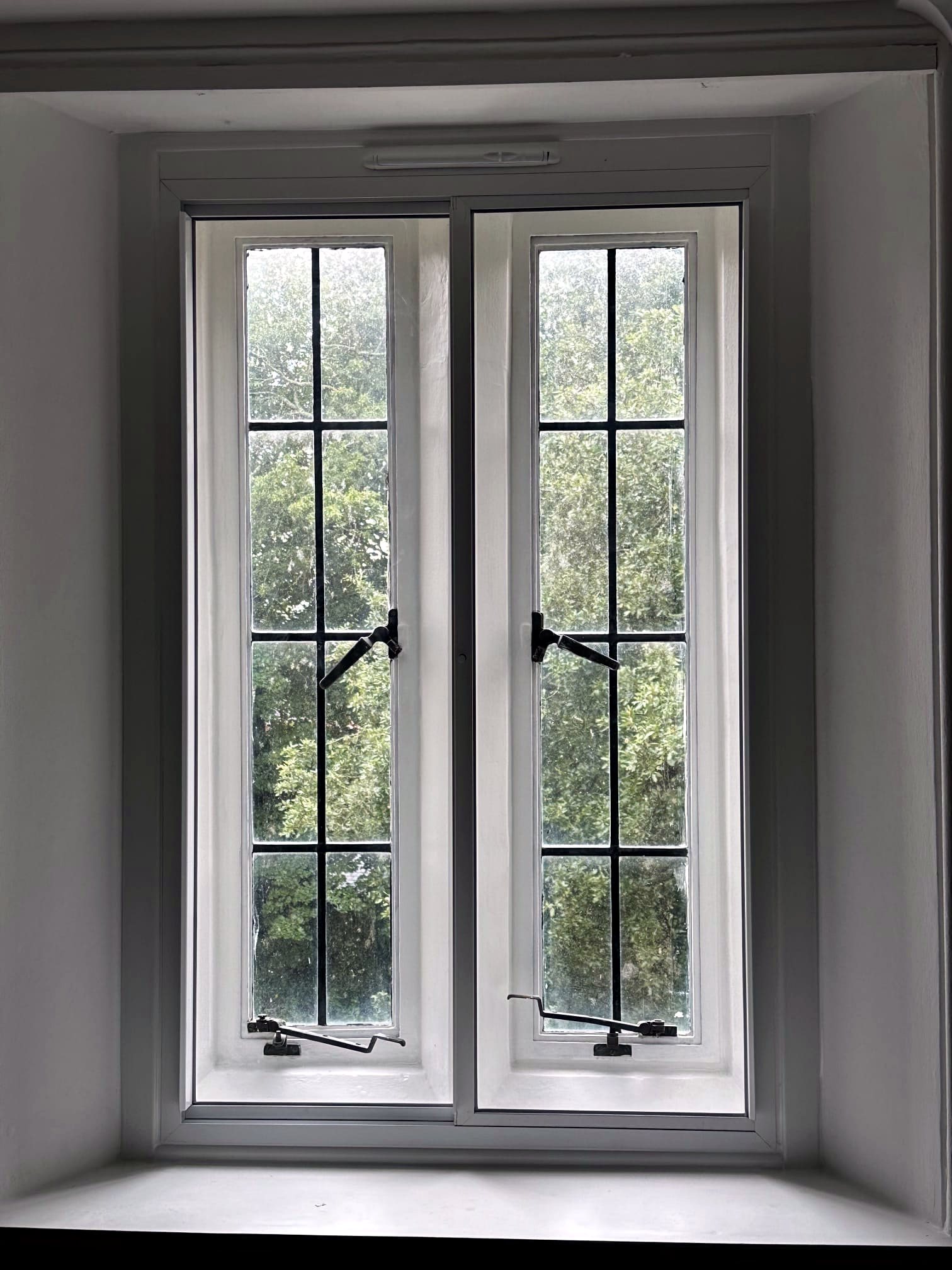A pair of white secondary glazing casements