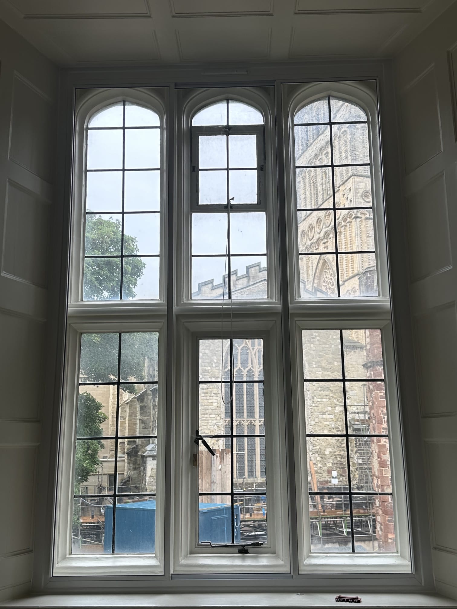 Large arched secondary glazing system on heritage property with cathedral views