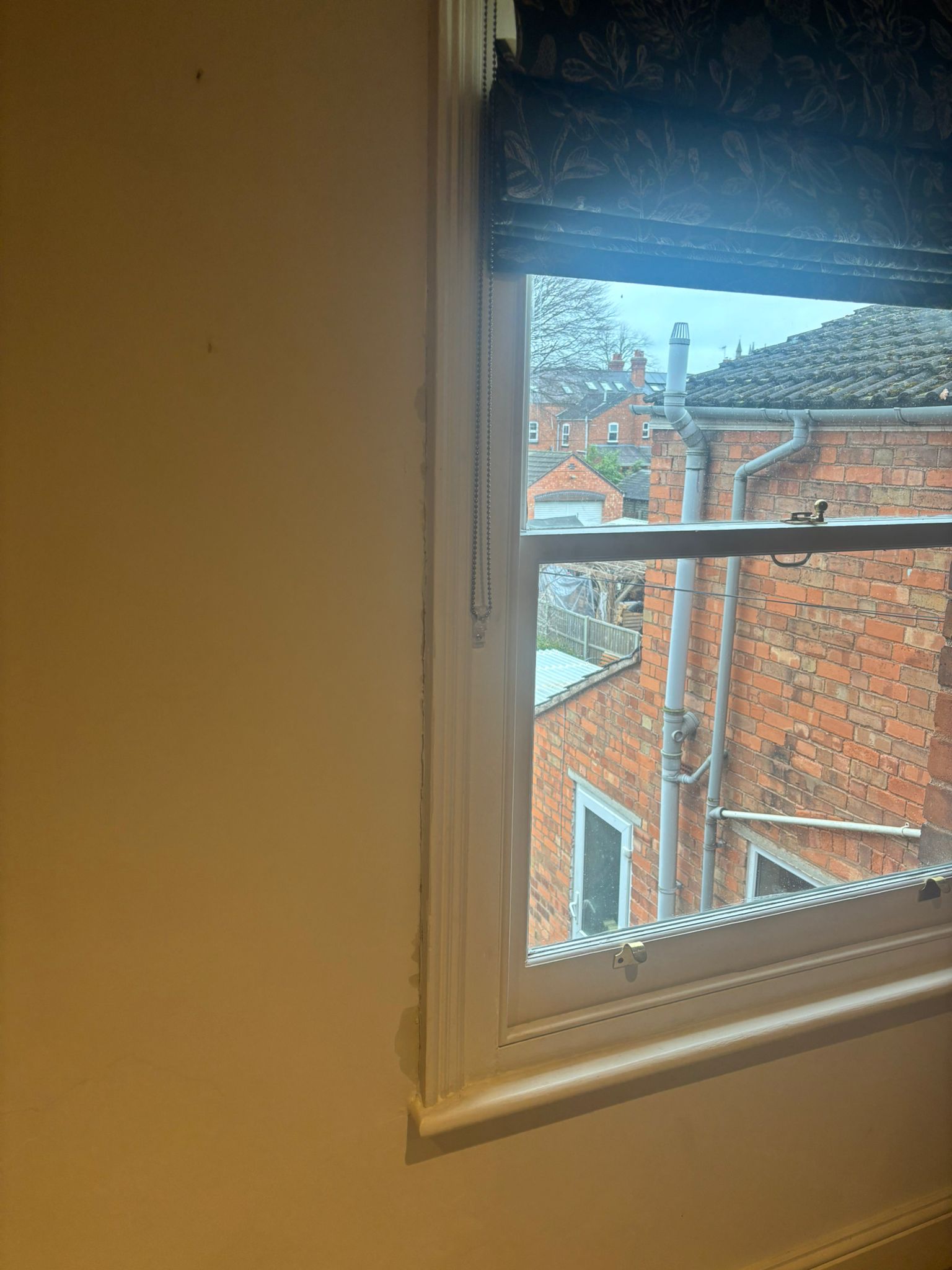 Vertical sliding secondary glazing on timber sash window in Victorian terrace property